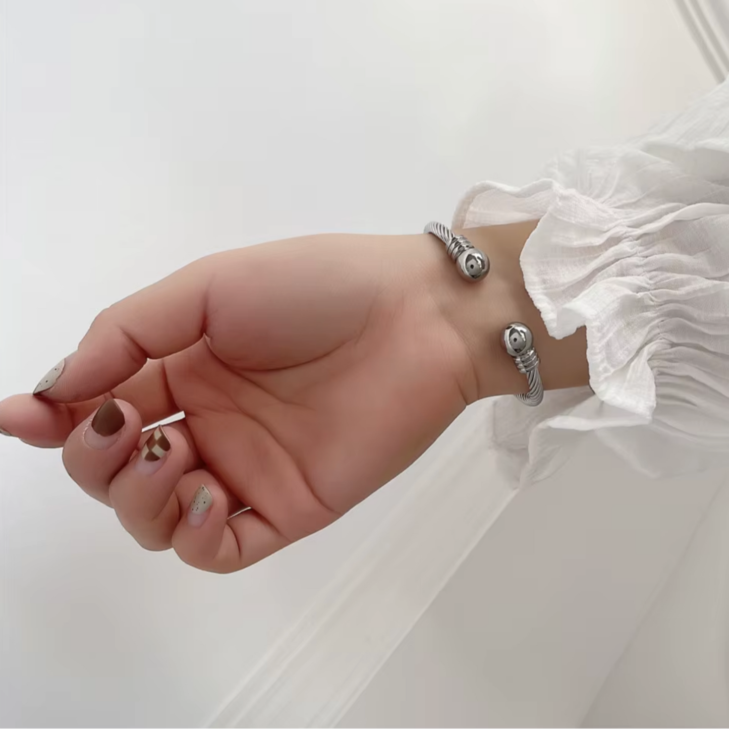 Twist Torque Bangle in White Gold